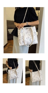 Detail of white tote bag with butterfly prints and thick braided rope shoulder straps