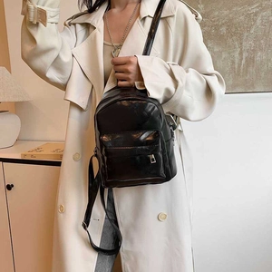 Fashionable black glossy PU leather backpack for women with large capacity and urban style