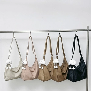 Solid color half-moon hobo bag set with plush cloud charms and adjustable wide straps