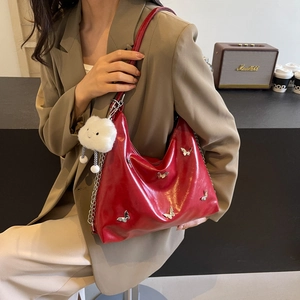 Bright red butterfly tote bag with silver metallic buckle and fluffy cloud charm