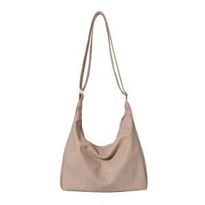 Minimalist nude hobo tote bag in premium faux leather with adjustable strap for commuting