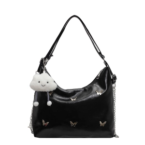 Chic black crescent hobo bag with silver butterfly studs and plush cloud charm