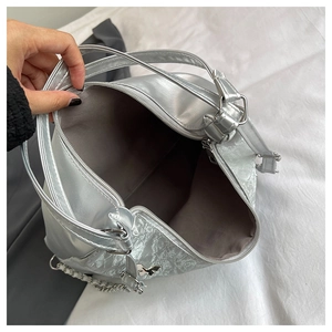 Detail view of large silver tote interior with fabric lining and sturdy metal zipper