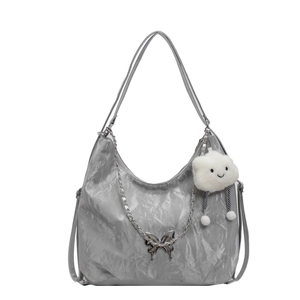 Silver metallic butterfly tote bag with chain strap and cloud plush charm for women