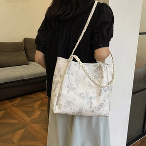White butterfly print tote bag with thick woven straps for casual summer fashion
