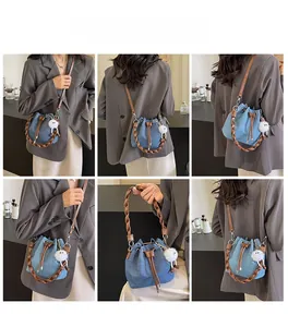Detailed views of blue denim bucket bag with woven handle and drawstring closure
