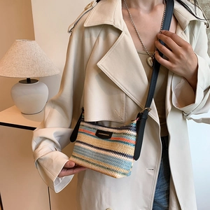 Colorful striped woven shoulder bag for summer beach outings with black leather strap