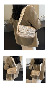 Detail of crossbody bag with blue wave pattern and wide jacquard strap on a model