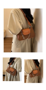 Detail of vintage patchwork underarm bag with silver floral chain and woven strap