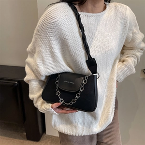 Retro black leather shoulder bag with floral silver chain and woven strap detail