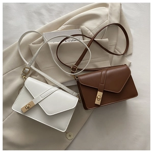 Detailed view of matte PU leather flap bags with geometric design and gold twist lock