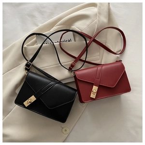Detail of vintage square crossbody bags with metallic gold twist lock in black and burgundy