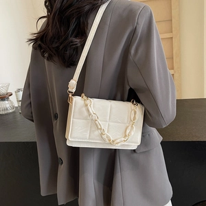Quilted off-white PU leather shoulder bag with decorative chain and adjustable strap