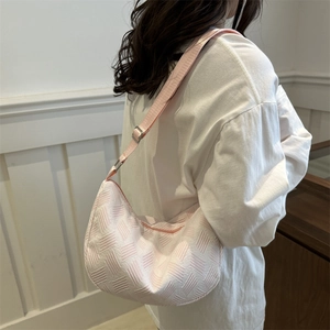 Minimalist light pink and white woven hobo bag with adjustable strap for women