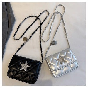 Close-up of diamond star embellishment on quilted chain cross-body small square bags