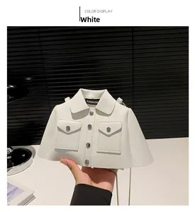 Detailed view of white crossbody bag with creative jacket design and silver chain strap