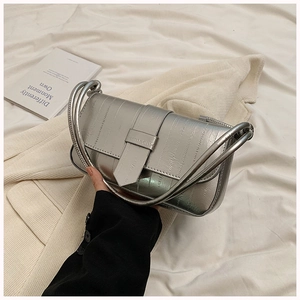 Silver metallic shoulder bag with unique multi-layered tubular handle and flap closure