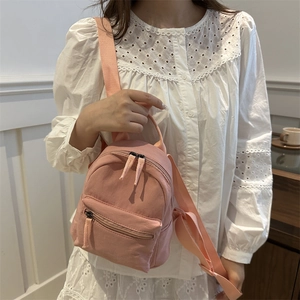 Pink nylon mini backpack and crossbody bag for women in a casual minimalist style