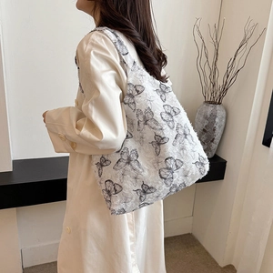 White butterfly print tote bag with 3D texture and spacious design for women