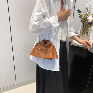 Unique jacket-shaped brown leather crossbody bag with white stitching and silver chain
