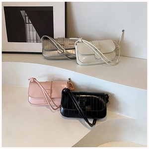 Chic textured faux-leather crossbody bags in black, white, pink, and silver options
