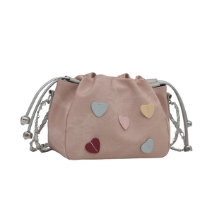 Pink heart patch bucket bag with drawstring closure and silver chain shoulder strap