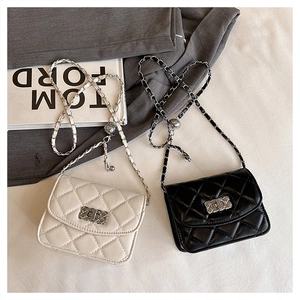 Detailed view of quilted leather mini crossbody bags with adjustable chain straps