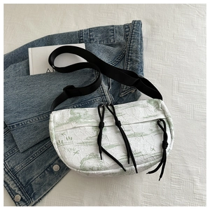 Detail of water-ink pattern on large capacity pleated nylon crossbody bag with drawstrings
