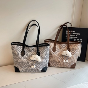 Large capacity vintage wave pattern canvas tote bag with leather handles and plush charm