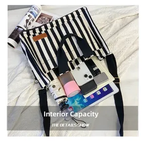 Detailed view showing large internal capacity of the striped canvas tote bag