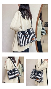 Three-way split view of a black and white striped canvas tote bag worn by a model