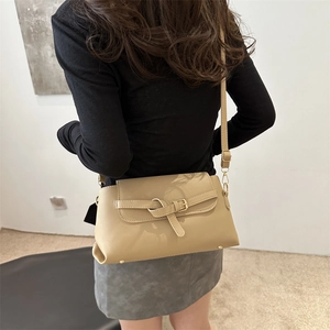 Elegant khaki minimalist crossbody bag with golden hardware and textured leather finish