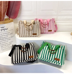 Striped canvas tote bags in four colors with leather fashion label and adjustable straps