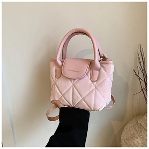 Detailed shot of pink quilted handbag showing fashion and bags text and leather texture