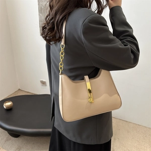 Chic milk tea hobo bag with gold metal lock buckle and elegant leather chain strap