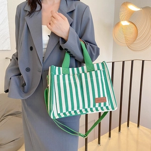 Green and white striped canvas tote bag with shoulder strap and large capacity