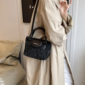 Classic black quilted crossbody bag with top handle and fashion lettering for women