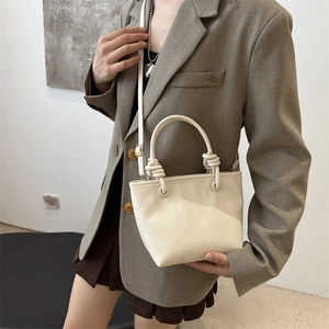 Chic cream white bucket bag with knotted handle and adjustable strap for women