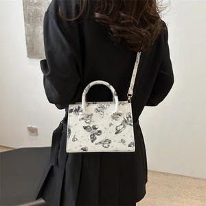 Butterfly print white crossbody bag with top handles and detachable shoulder strap