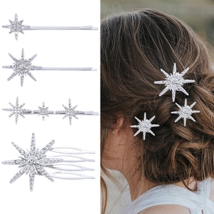 Detail of silver starburst hairpins and comb set with sparkling rhinestones on model