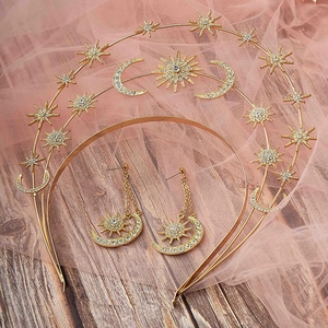 Detail of bohemian sun moon star headpiece and tassel earrings set with gold rhinestones