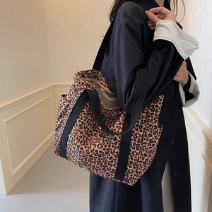 Large leopard print tote bag with black straps for daily commute and casual style