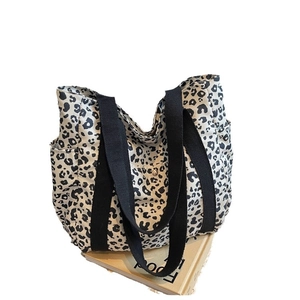 Large leopard print canvas tote bag with black wide straps and side pockets for women