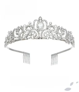 Detailed view of silver crystal crown with pear-shaped center stone and hair combs