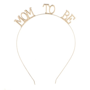 Detailed view of the gold Mom To Be metal headband for baby shower party celebrations