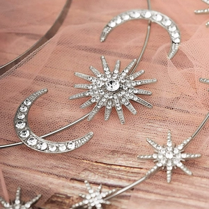 Close-up of bohemian silver star and moon headband with sparkling crystal rhinestones