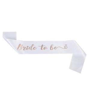 Detail showing white satin sash with rose gold Bride to be text for wedding party