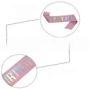Close-up of pink glitter birthday girl sash with holographic gold lettering detail