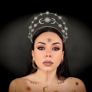 Bohemian gold celestial crown with stars and moon elements worn by a model