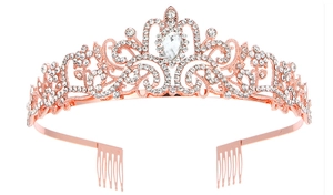 Close-up of rose gold crystal crown with intricate scrollwork and teardrop zircon